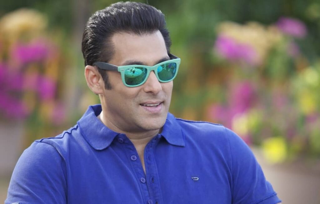 Actor Salman Khan wearing sunglasses and smiling