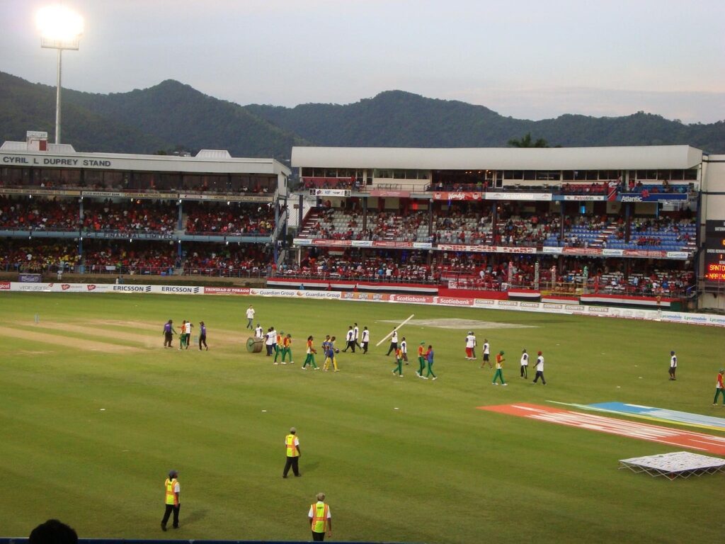Cricket team huddled on field